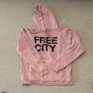 freecity lavender pullover hoodie with yellow logo